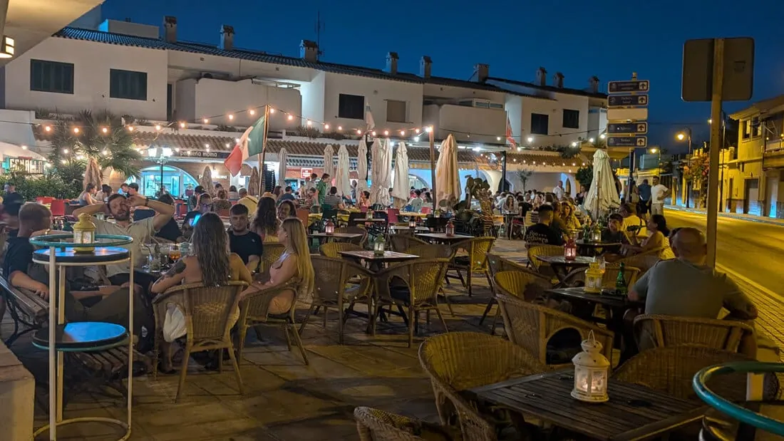 Lit terraces at dusk by the Cabo de Palos harbour